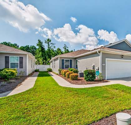 A residential house with a garage and a driveway.