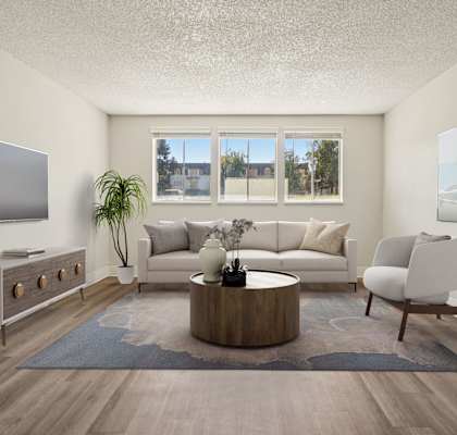 Bright living room with open layout at Trailgrove Apartments near the Denver Tech Center.