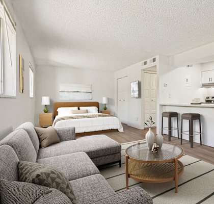Open-concept living room and kitchen at Willowstone Apartments in Southeast Denver with modern finishes and natural light.