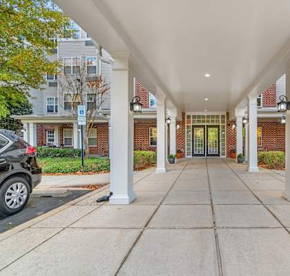 Walkway with white pillars at River Point Apartments, Maryland