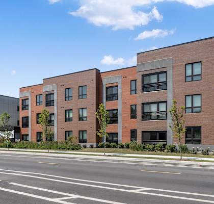 a large brick building on the side of a street