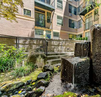 a water feature in front of some buildings