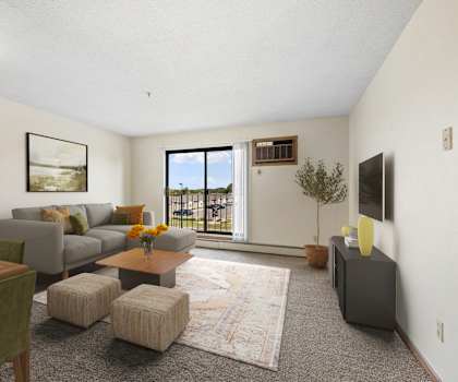 the living room of an apartment with a couch and a table