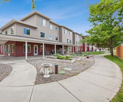 the preserve at ballantyne commons apartments exterior with walkway and trees