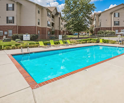 the preserve at ballantyne commons resort style pool with apartment buildings in the background