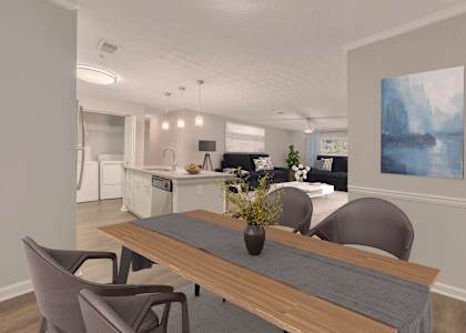 A modern kitchen with a dining table and chairs.