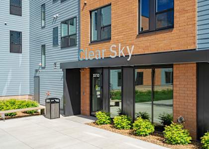 The front of a building with the name "Clear Sky" on it.