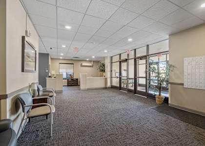 the preserve at cardinal courts spacious lobby with chairs and tables
