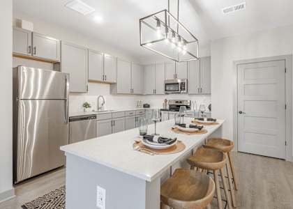 Modern kitchen with a white countertop and stainless steel appliances at Arbour Place Apartments, Indiana