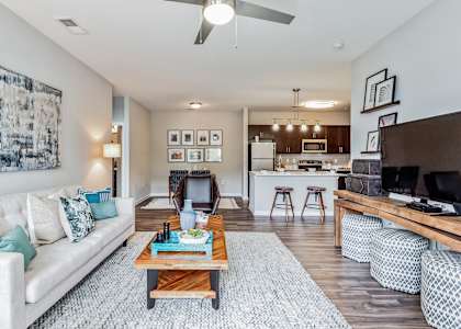 an open living room and kitchen with a couch and a coffee table at The Atlantic Mountain Island, North Carolina