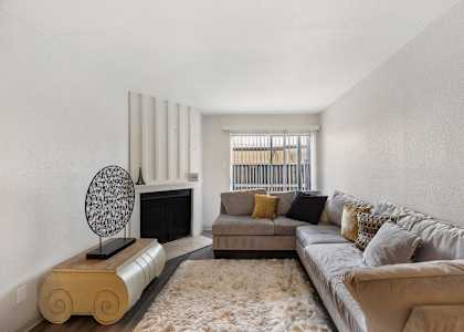 a living room with two couches and a fireplace