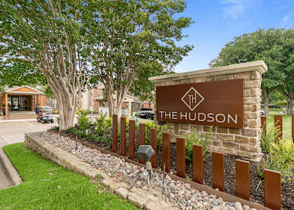 a photo of the hudson sign in front of the building at The Hudson, North Richland Hills, TX