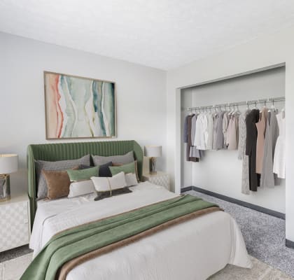 a bedroom with a large bed and a closet with a sliding door