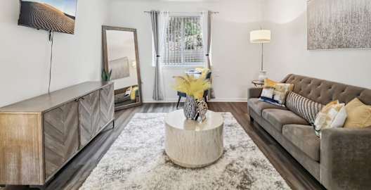 a living room with a couch and a coffee table at Oaks at Oxon Hill, Oxon Hill, Maryland