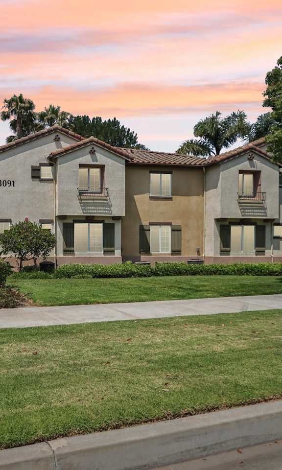 Exterior view of Villas at the park at sunset