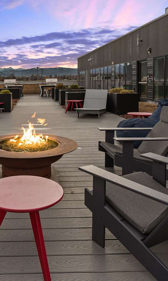 Patio with chairs and firepit at Cannery Flats, Montana, 59715