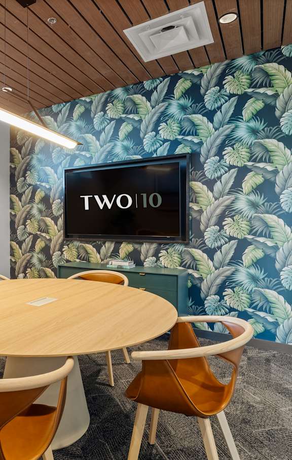 A conference room with a round table and chairs at Two 10 by Vintage, Shoreline, Washington