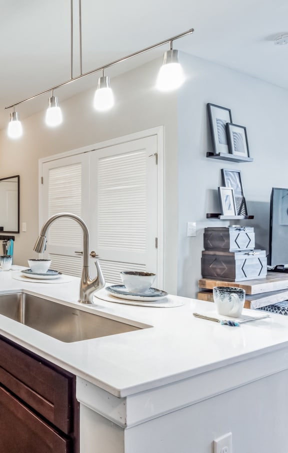 an open kitchen with a large counter top and a sink at The Atlantic Mountain Island, Charlotte, North Carolina