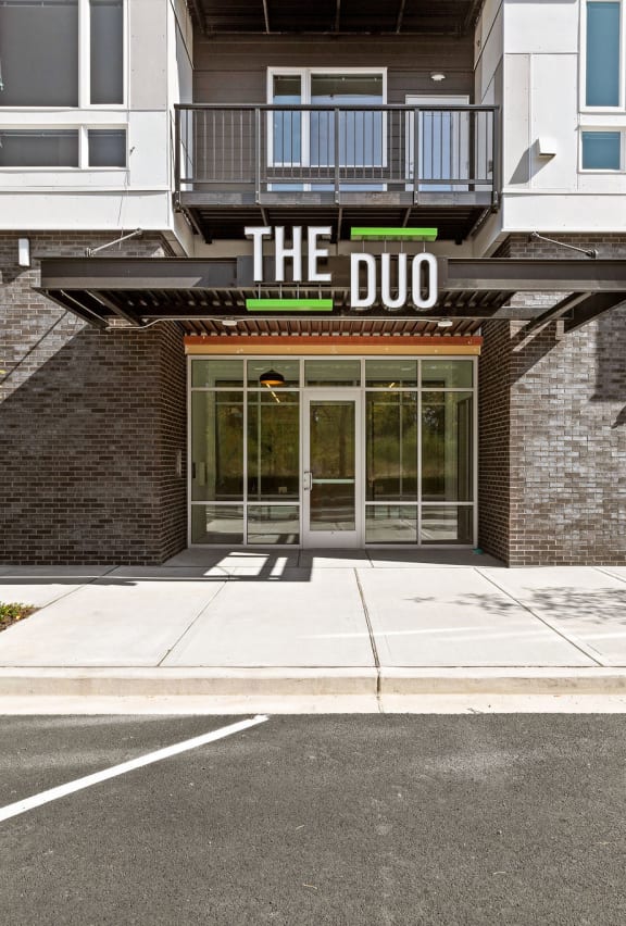 front of the duo with sidewalk and parking lot