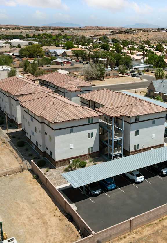 A large building with a parking lot in front of it.