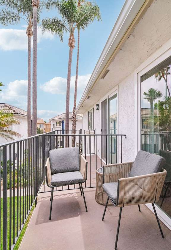 A patio with table and chairs at villa campana