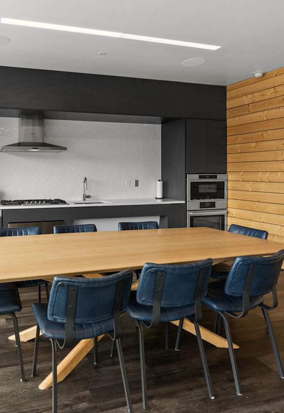 Modern Kitchen with long dining table and chairs at Cannery Flats, Bozeman, 59715