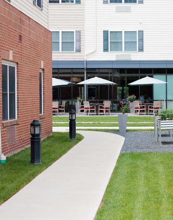 A gym with treadmills, exercise bikes, and other equipment.