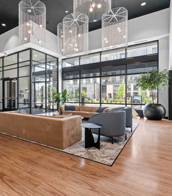 A modern interior with a wooden floor and a glass wall.