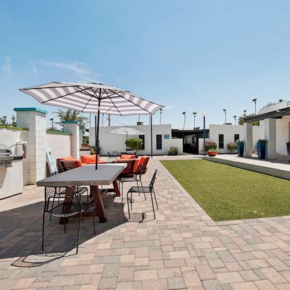 Outdoor patio with BBQ, table and chairs at Palm Villas, Scottsdale, AZ, 85257