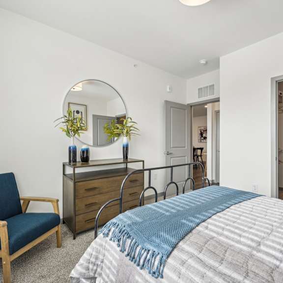 a bedroom with a bed  at The Quarry Luxury Apartment Homes, Fort Collins, CO, 80526