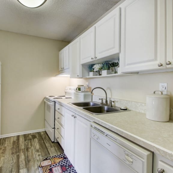 Derby Park Apartments in Daytona Beach, FL photo of a kitchen with white cabinets