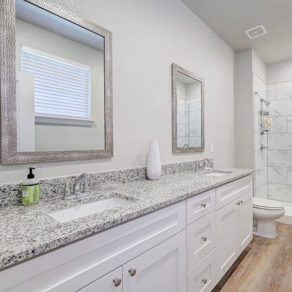 the guest bathroom has a large shower and a toilet