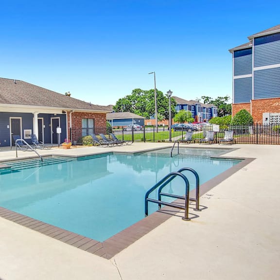 A small pool with a metal ladder.