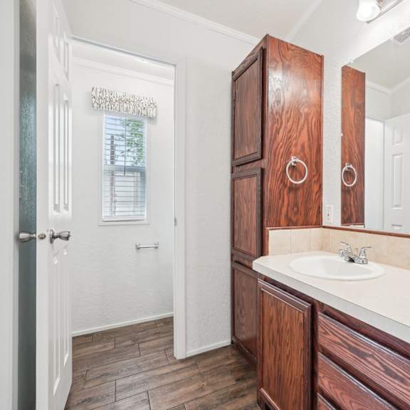 A Bathroom with a Sink at Buckingham Village Apartments, Universal City, TX, 78148