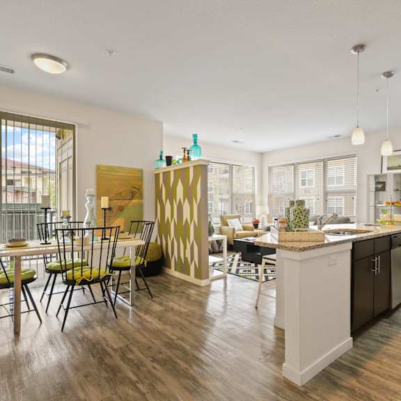 an open floor plan with a kitchen and dining area at WestLink at Oak Station, Colorado, 80215