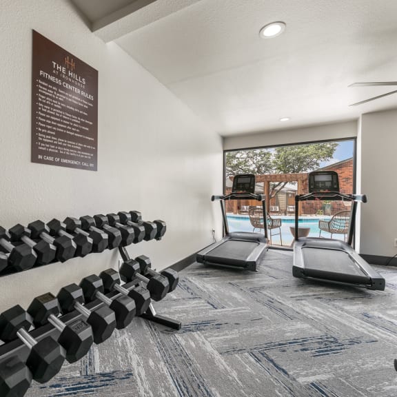 the gym at the shiloh green apartments in kennesaw, ga at The Hills at Ironhorse, North Richland Hills, 76180