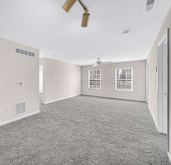 a kitchen with white appliances and brown cabinets Brickshire Apartments, Merrillville, IN