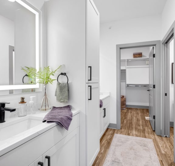 a white bathroom with a sink and a mirror at Meridian at CityPlace, Minnesota