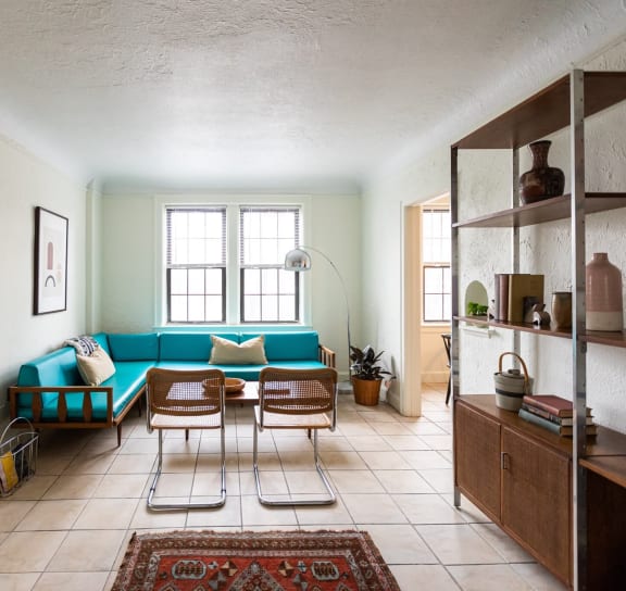 a bedroom with a bed and a door to a bathroom