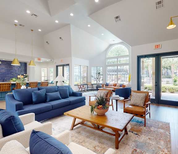 a living room with couches chairs and a coffee table at Remington Ranch, San Antonio, TX