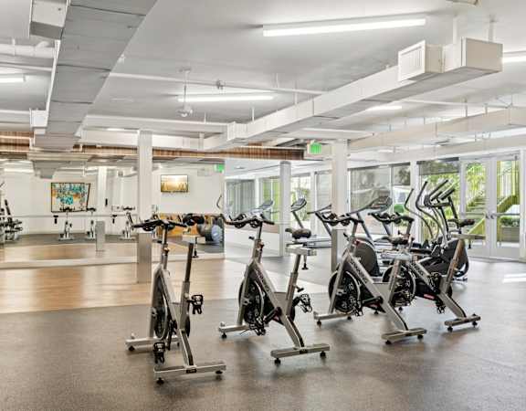 A gym with exercise bikes and other equipment.