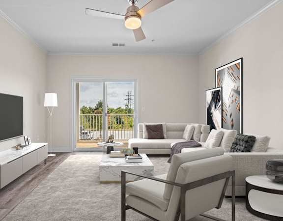 A modern living room with a flat screen TV, a sofa set, a coffee table, and a sliding glass door leading to a balcony.