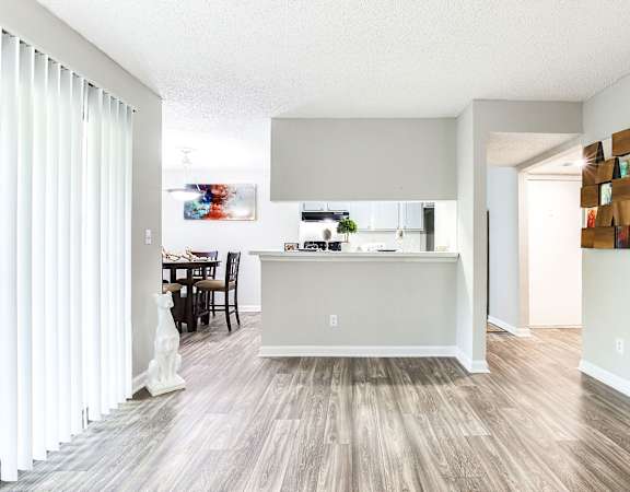 a kitchen and dining area in a 555 waverly unit