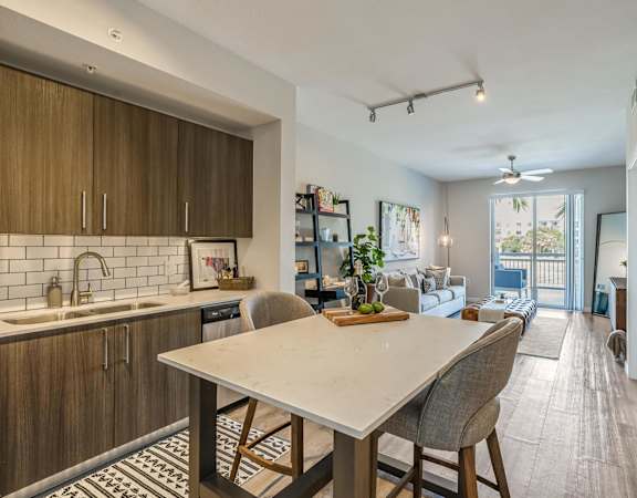 an open floor plan with a kitchen and dining table