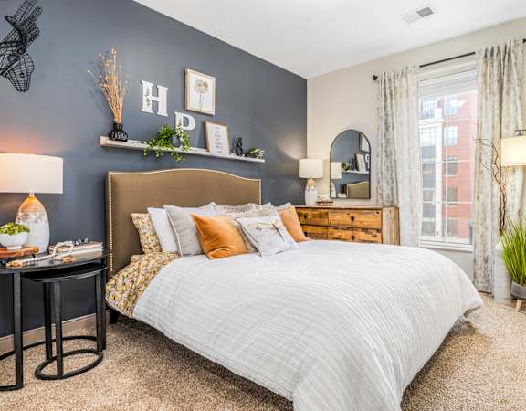 a bedroom with a bed and a window