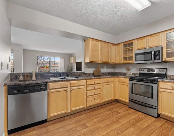 Kitchen with Stainless Steel Appliances at Mallard Creek, Minnesota, 55427