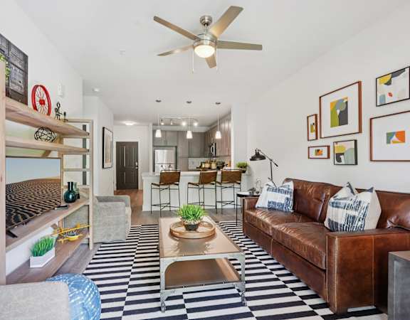 A living room with a black and white checkered floor.