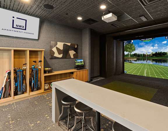 a conference room with a large screen tv and a table with chairs