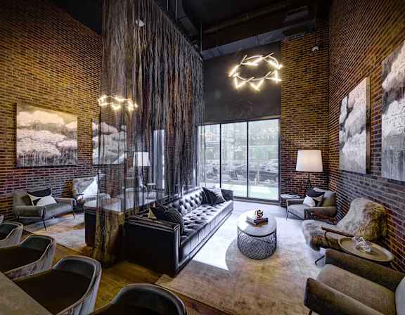 A cityscape with a tall building in the background and a modern building in the foreground. at The Mason Apartments, Illinois, 60607