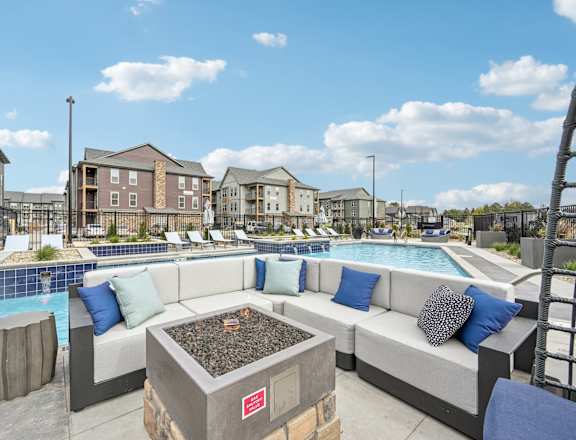 outdoor seating area with pool and buildings at the estates apartments at The Quarry Luxury Apartment Homes, Fort Collins, 80526
